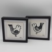A Pair of Framed bird tiles